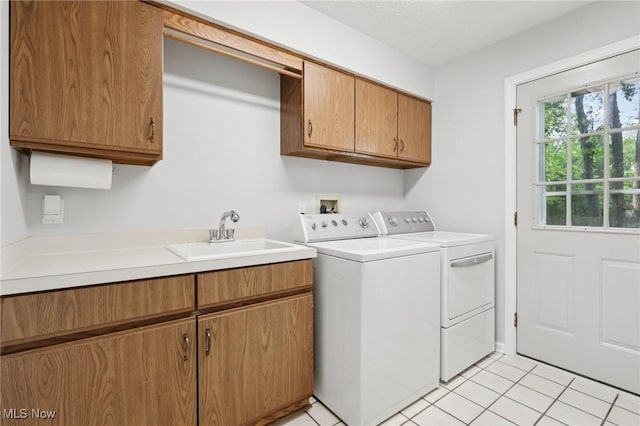 4610 Briarcliff Trl, Copley, OH 44321 - laundry area featuring cabinet space, independent washer and dryer, and light tile patterned flooring