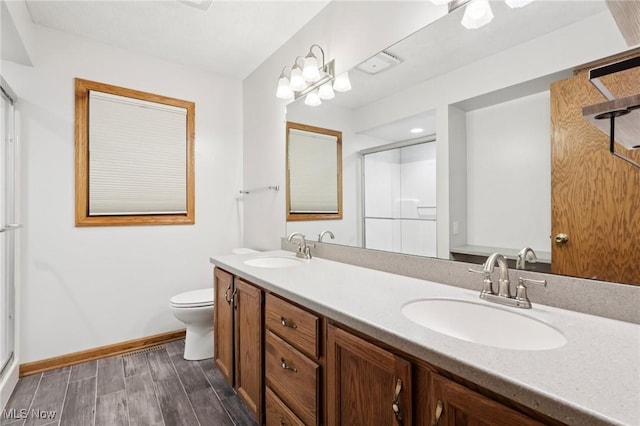 4610 Briarcliff Trl, Copley, OH 44321 - bathroom with a stall shower, double vanity, toilet, and baseboards