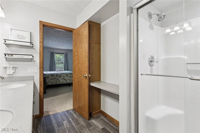 4610 Briarcliff Trl, Copley, OH 44321 - ensuite bathroom featuring double vanity, a stall shower, and wood finish floors