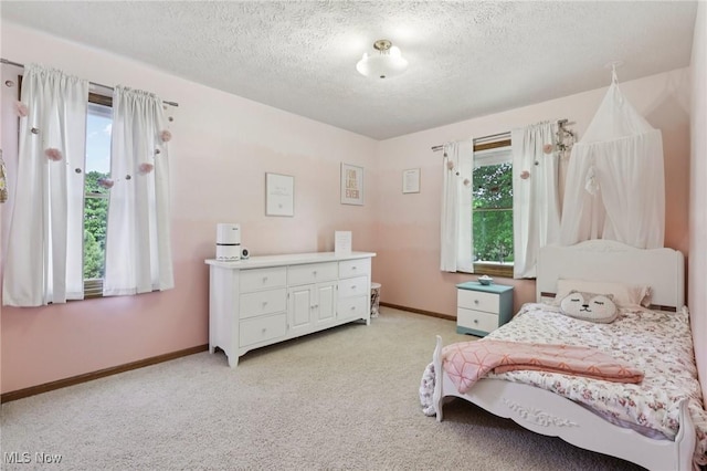 4610 Briarcliff Trl, Copley, OH 44321 - bedroom with multiple windows, light colored carpet, a textured ceiling, and baseboards