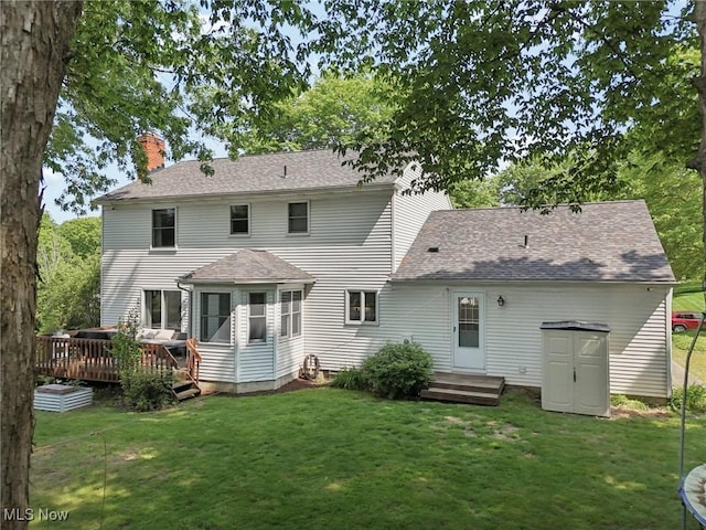 4610 Briarcliff Trl, Copley, OH 44321 - rear view of property featuring a chimney, a yard, a wooden deck, and a shingled roof