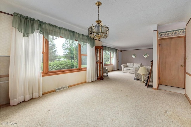 10031 Akins Rd, North Royalton, OH 44133 - unfurnished living room featuring carpet floors and a chandelier