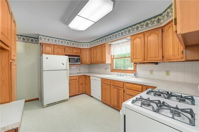 10031 Akins Rd, North Royalton, OH 44133 - kitchen featuring white appliances, backsplash, light countertops, and brown cabinets