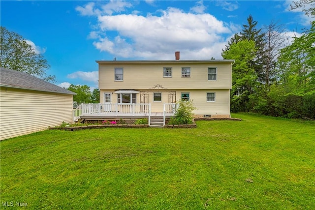 10031 Akins Rd, North Royalton, OH 44133 - rear view of house featuring a deck, a yard, and a chimney