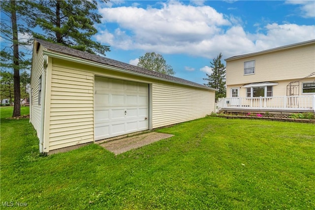 10031 Akins Rd, North Royalton, OH 44133 - view of grassy yard with a deck, a garage, an outbuilding, and driveway
