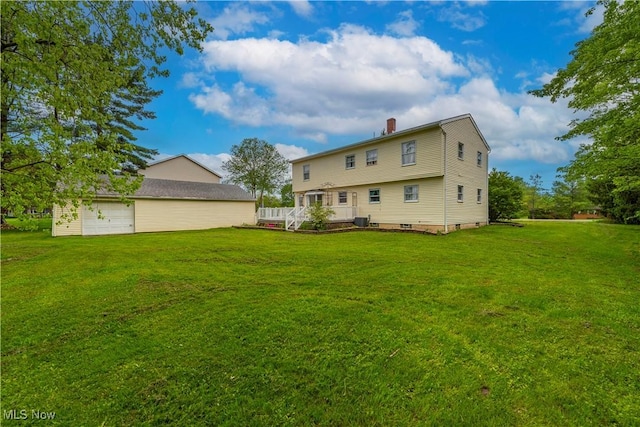 10031 Akins Rd, North Royalton, OH 44133 - rear view of property with a chimney, a yard, and a wooden deck