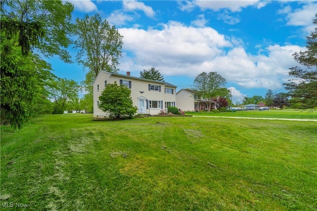 10031 Akins Rd, North Royalton, OH 44133 - view of front of house with a front yard and a chimney