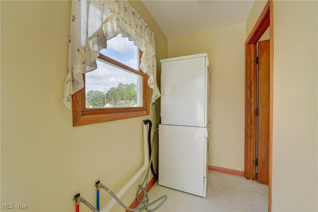 10031 Akins Rd, North Royalton, OH 44133 - washroom with estacked washer and dryer and baseboards