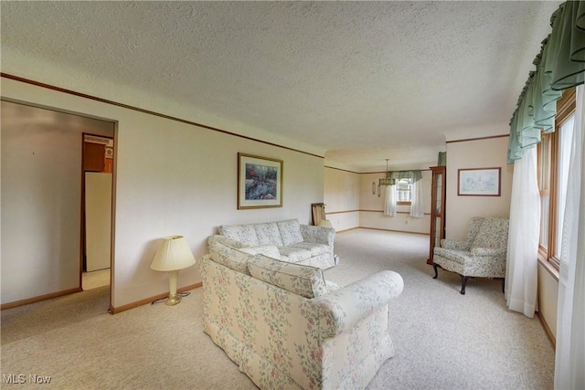 10031 Akins Rd, North Royalton, OH 44133 - carpeted living room featuring a textured ceiling and a chandelier