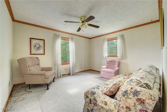 10031 Akins Rd, North Royalton, OH 44133 - carpeted living area with crown molding, plenty of natural light, ceiling fan, and a textured ceiling