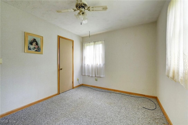 10031 Akins Rd, North Royalton, OH 44133 - carpeted spare room featuring a ceiling fan and baseboards