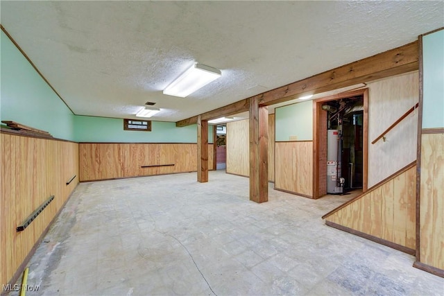 10031 Akins Rd, North Royalton, OH 44133 - finished below grade area featuring water heater, a textured ceiling, and wood walls