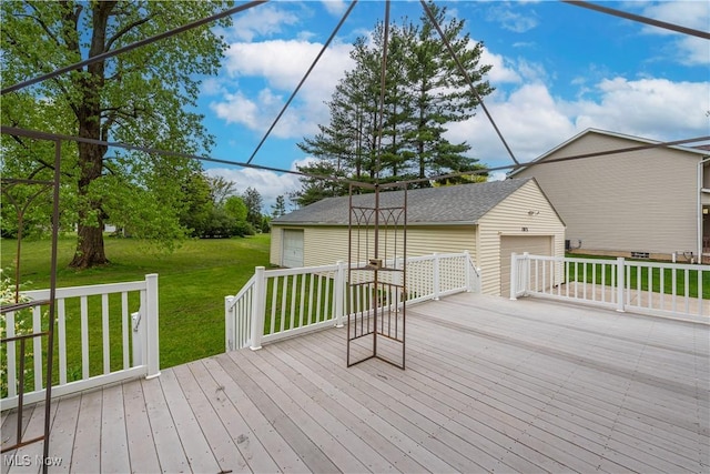 10031 Akins Rd, North Royalton, OH 44133 - wooden deck with a lawn, an outbuilding, an attached garage, and driveway