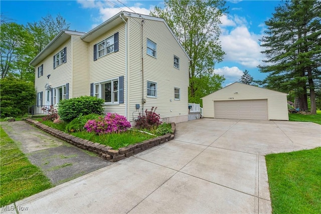 10031 Akins Rd, North Royalton, OH 44133 - view of side of property featuring an outdoor structure and a detached garage