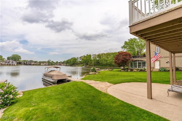 5325 S Island Dr NW, Canton, OH 44718 - view of green lawn featuring a water view, a dock, and a patio area