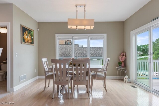 5325 S Island Dr NW, Canton, OH 44718 - dining area with light wood-style floors and baseboards