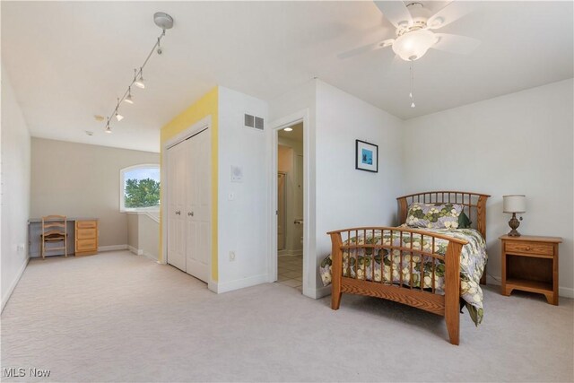 5325 S Island Dr NW, Canton, OH 44718 - bedroom with carpet flooring, track lighting, baseboards, and a ceiling fan