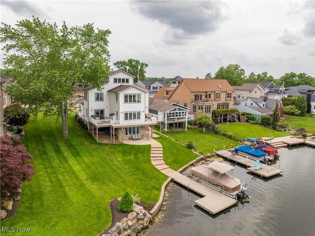 5325 S Island Dr NW, Canton, OH 44718 - back of house featuring a water view, a lawn, and a residential view