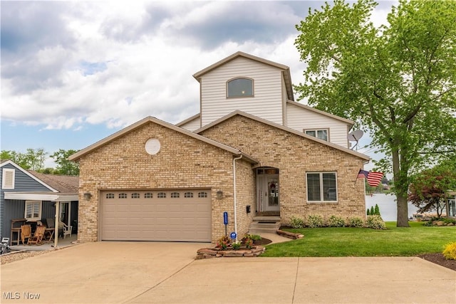 5325 S Island Dr NW, Canton, OH 44718 - view of front facade with driveway, a garage, a front lawn, and brick siding