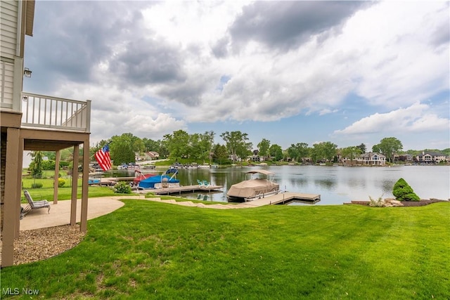 5325 S Island Dr NW, Canton, OH 44718 - view of green lawn featuring a water view, a floating dock, and a patio area