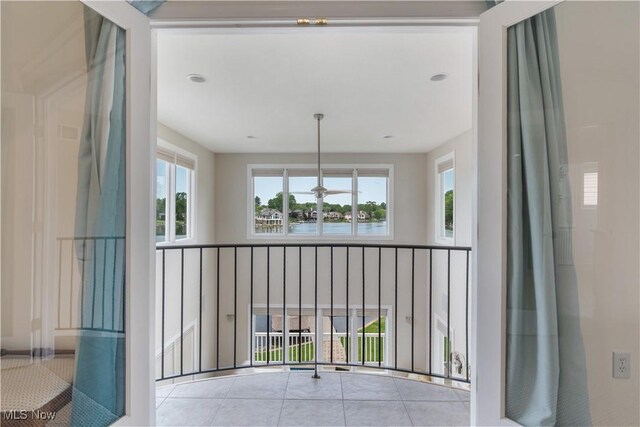 5325 S Island Dr NW, Canton, OH 44718 - corridor featuring a water view and tile patterned floors