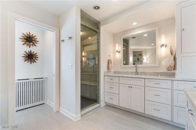 5325 S Island Dr NW, Canton, OH 44718 - full bathroom with vanity, baseboards, recessed lighting, and a shower with shower door