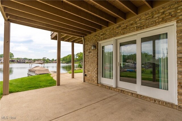 5325 S Island Dr NW, Canton, OH 44718 - view of patio featuring a water view and a boat dock