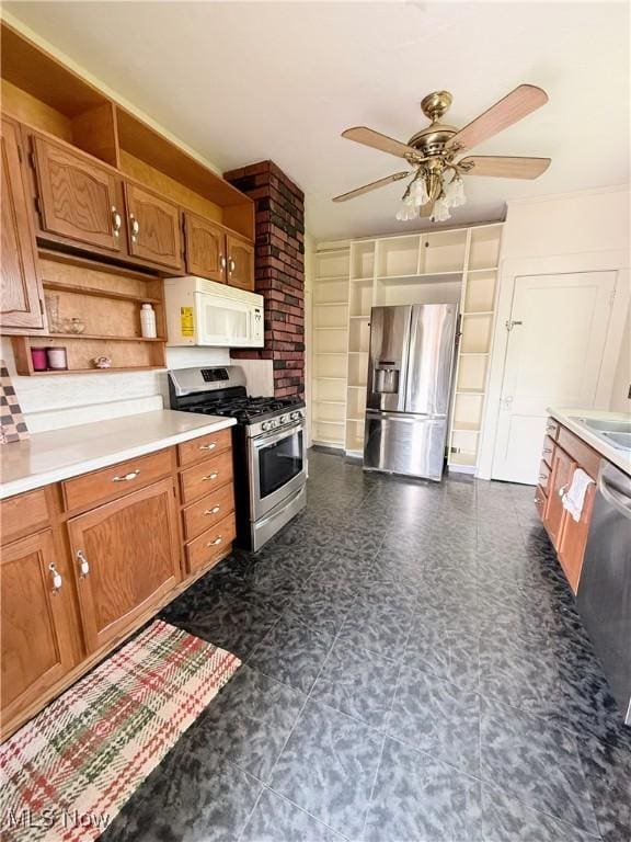249 S 15th St, Sebring, OH 44672 - kitchen featuring stainless steel appliances, brown cabinets, a ceiling fan, and light countertops