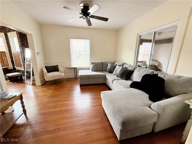 249 S 15th St, Sebring, OH 44672 - living room with ornamental molding, ceiling fan, and light wood finished floors