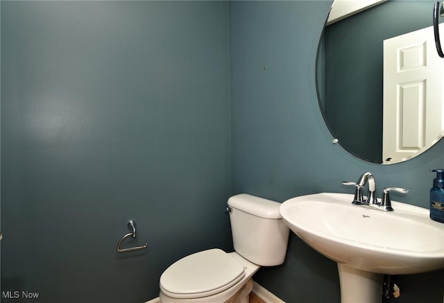 1261 W 74, Cleveland, OH 44102 - half bath with toilet, baseboards, and a sink