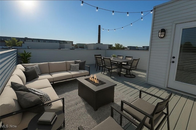 1261 W 74, Cleveland, OH 44102 - wooden terrace featuring an outdoor living space with a fire pit and outdoor dining space