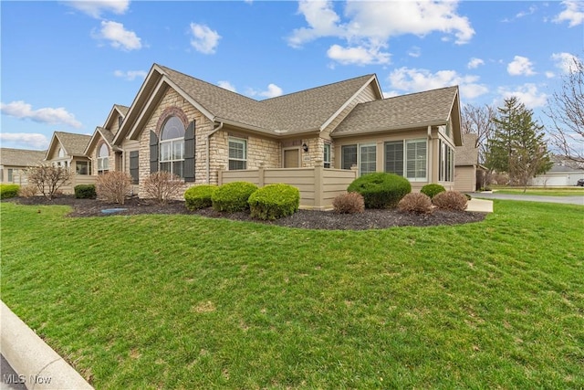 4004 Coventry Ln, Huron, OH 44839 - view of side of property with stone siding and roof with shingles