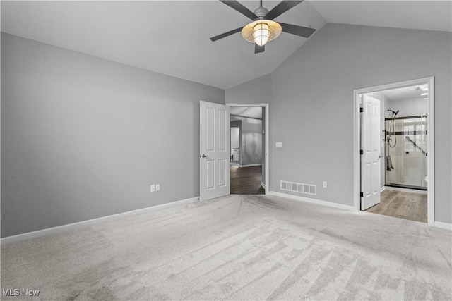 4004 Coventry Ln, Huron, OH 44839 - unfurnished bedroom featuring carpet, lofted ceiling, baseboards, and ensuite bath