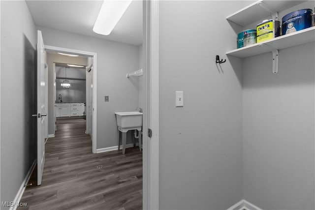 4004 Coventry Ln, Huron, OH 44839 - laundry room with dark wood-style flooring, baseboards, and a sink