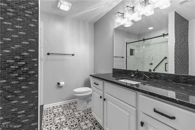 4004 Coventry Ln, Huron, OH 44839 - full bath with vanity, toilet, a marble finish shower, tile patterned floors, and baseboards