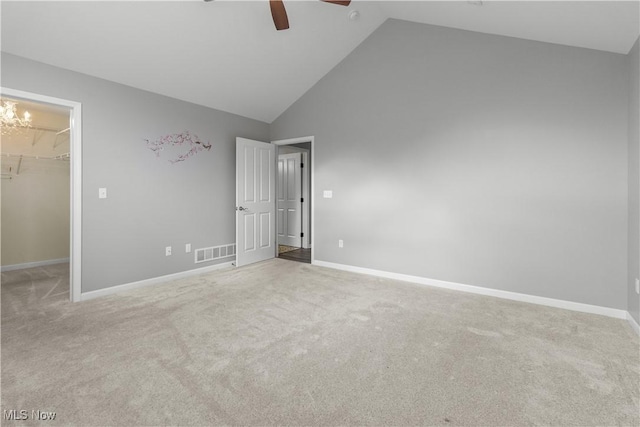 4004 Coventry Ln, Huron, OH 44839 - unfurnished bedroom with a spacious closet, carpet flooring, a chandelier, and high vaulted ceiling