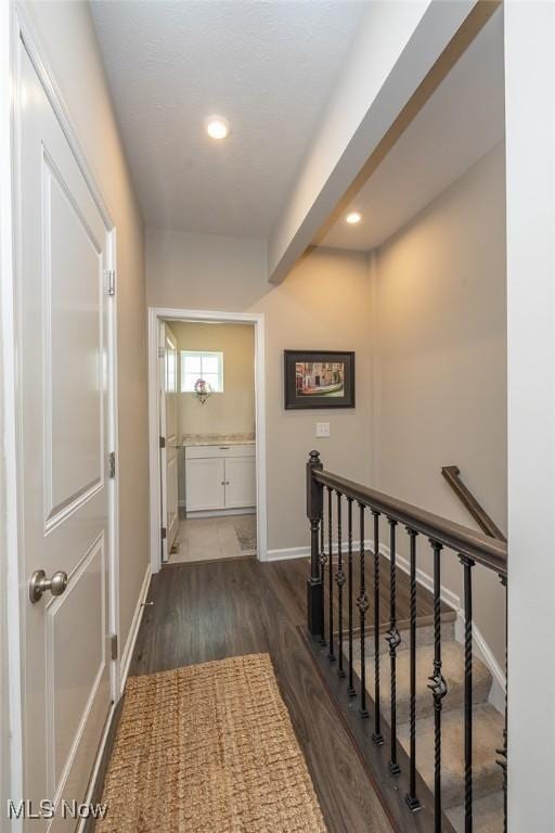 12136 White Tail Run, Columbia Station, OH 44028 - corridor with an upstairs landing, wood finished floors, baseboards, recessed lighting, and beam ceiling