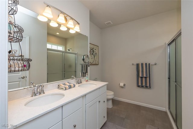 12136 White Tail Run, Columbia Station, OH 44028 - full bathroom with a stall shower, double vanity, toilet, and baseboards