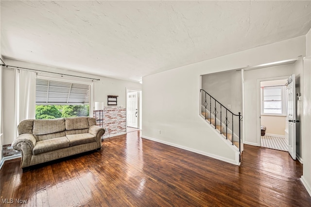 23701 Colbourne Rd, Euclid, OH 44123 - living room with hardwood / wood-style flooring, stairs, and baseboards