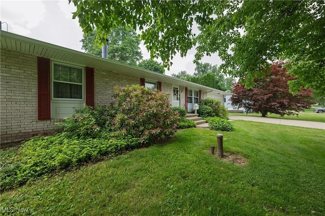 1214 Highwood Dr, New Franklin, OH 44216 - ranch-style house featuring brick siding, a front yard, concrete driveway, and a garage