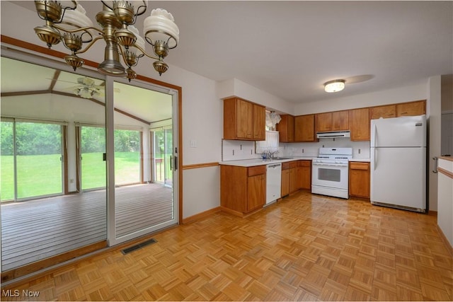 1214 Highwood Dr, New Franklin, OH 44216 - kitchen with white appliances, a sink, under cabinet range hood, light countertops, and brown cabinets