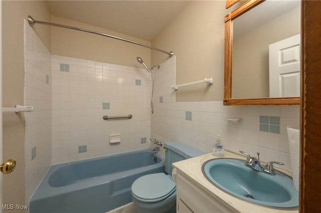 1214 Highwood Dr, New Franklin, OH 44216 - bathroom with tub / shower combination, vanity, toilet, and tile walls