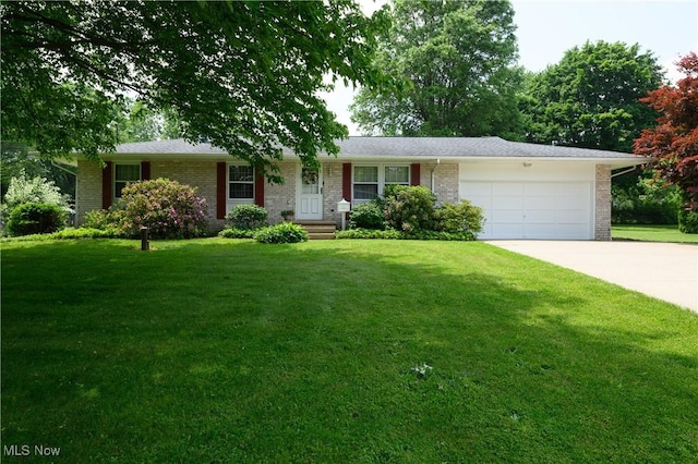 1214 Highwood Dr, New Franklin, OH 44216 - ranch-style house with brick siding, a garage, concrete driveway, and a front lawn