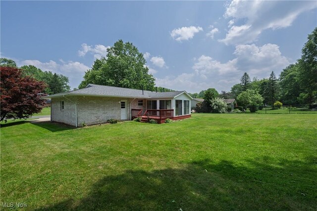 1214 Highwood Dr, New Franklin, OH 44216 - back of property featuring a deck and brick siding