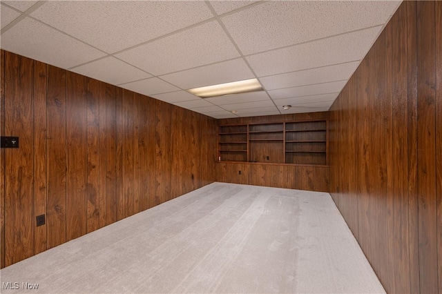 1214 Highwood Dr, New Franklin, OH 44216 - carpeted spare room with wooden walls, built in features, and a paneled ceiling