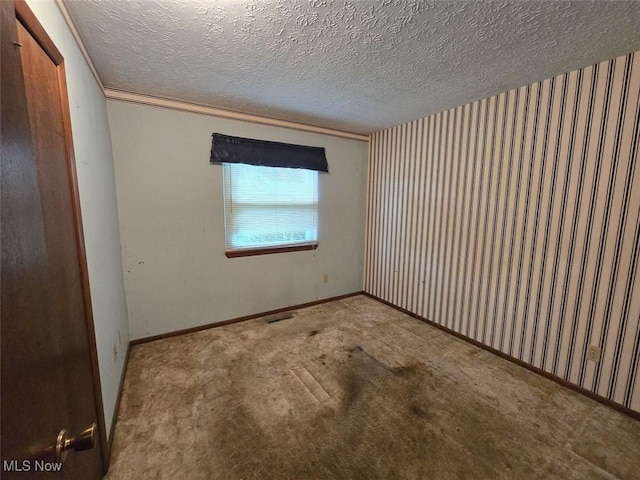 3212 Foxmoor St NE, Hartville, OH 44632 - unfurnished room featuring carpet flooring, a textured ceiling, and baseboards