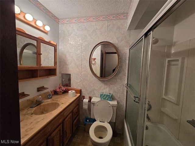 3212 Foxmoor St NE, Hartville, OH 44632 - bathroom with a textured ceiling, shower / bath combination with glass door, vanity, and toilet