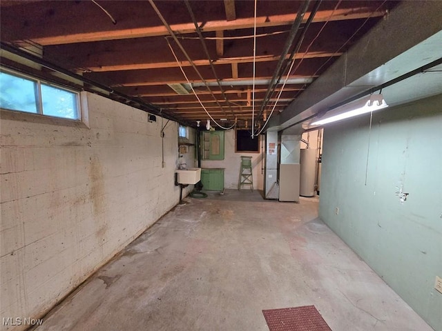 3212 Foxmoor St NE, Hartville, OH 44632 - below grade area featuring heating unit, a sink, and water heater