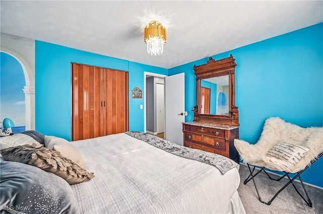 245 N Rd, Niles, OH 44446 - carpeted bedroom with a closet, a chandelier, and arched walkways