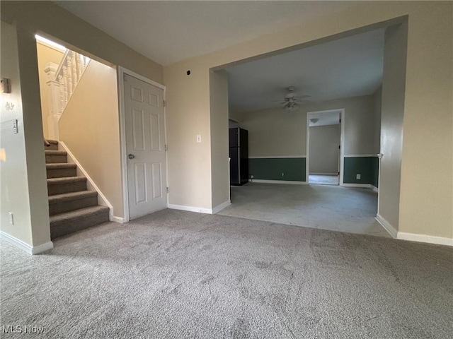 4721 Ardmore Ave, Cleveland, OH 44144 - unfurnished living room featuring carpet floors, stairway, ceiling fan, and baseboards